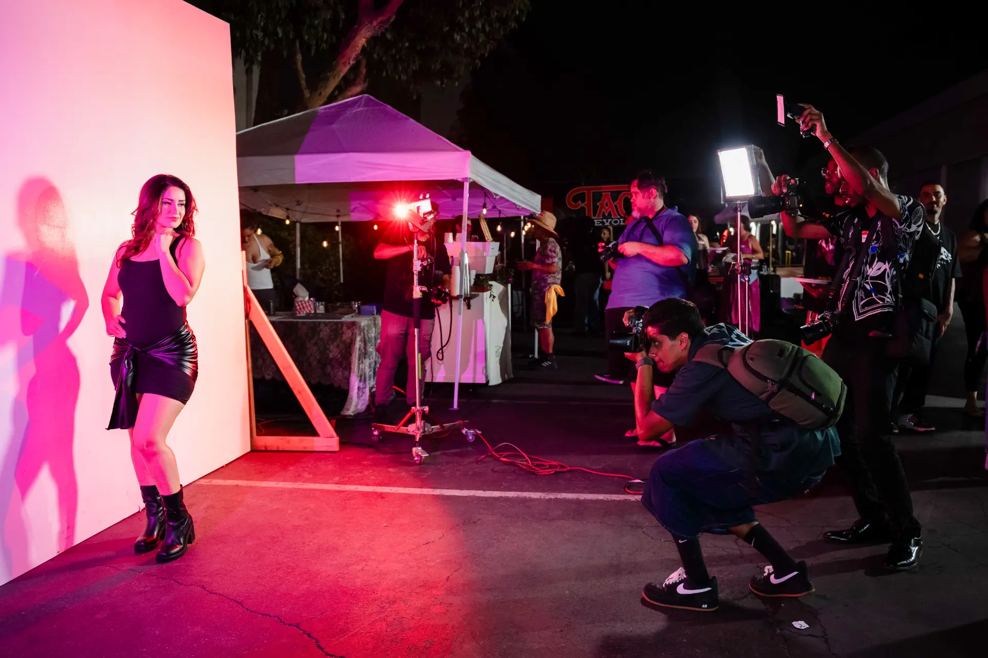 Photographers capturing a live portrait at the XPSR Studio Social
